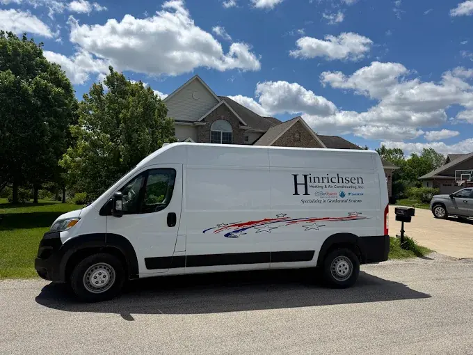 Hinrichsen Heating & Air Conditioning, Inc. service van — Specializing in Geothermal Systems — in a Central Illinois neighborhood